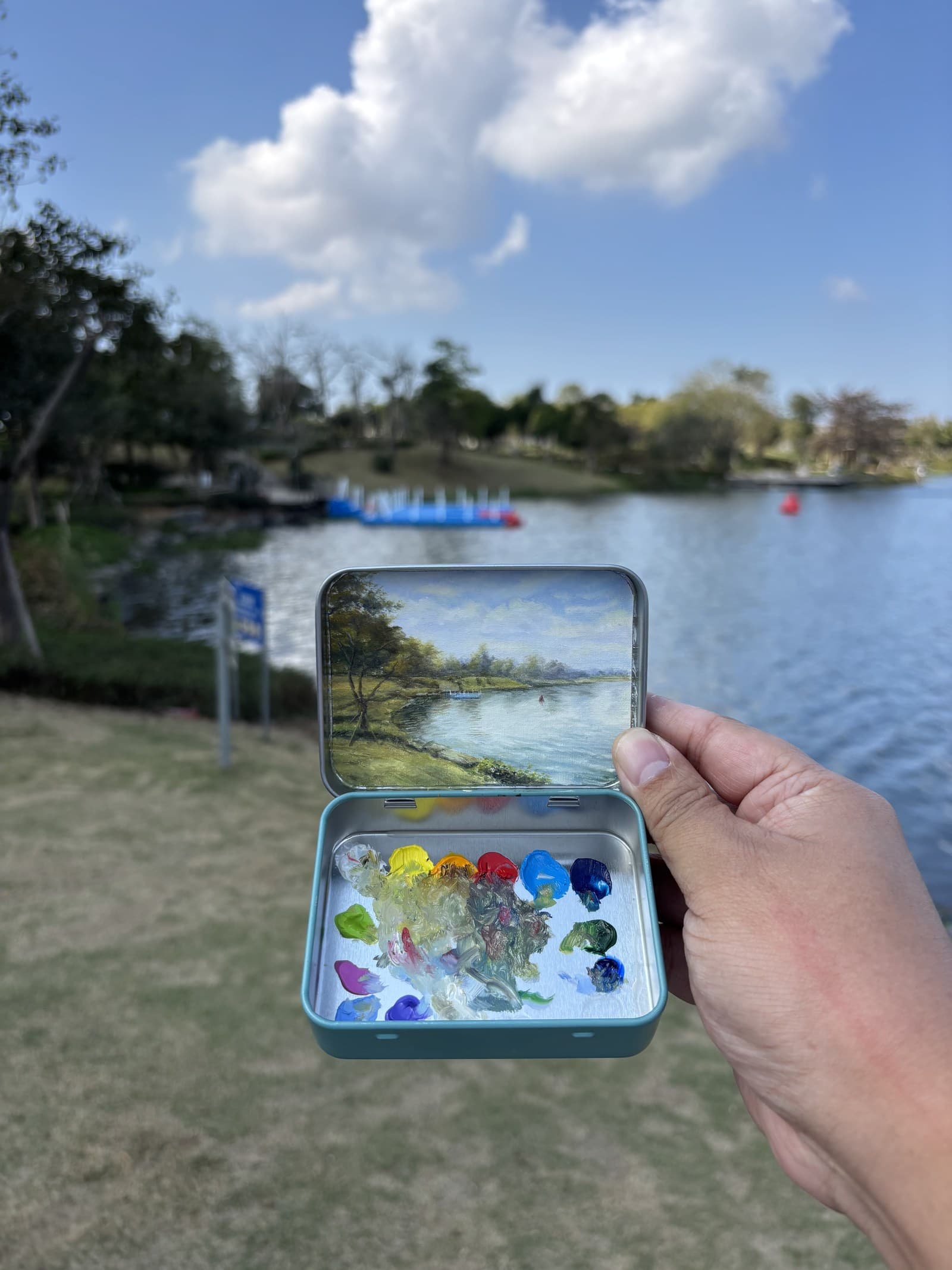 Pocket painting open in hand before gifting